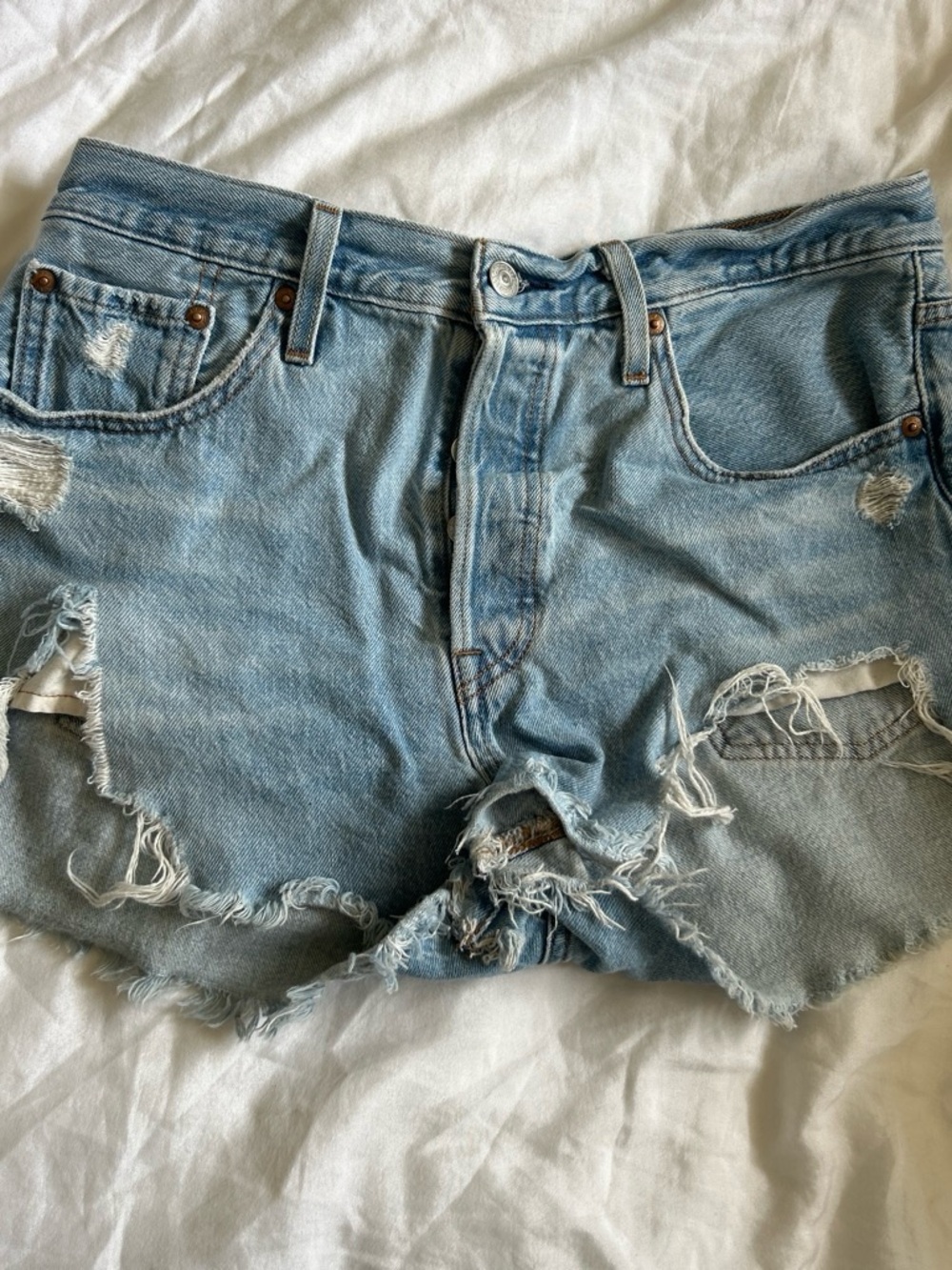 Levi’s 501 Light Blue Distressed Denim Shorts